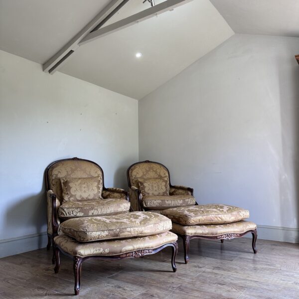 Pair of armchairs with matching footstools